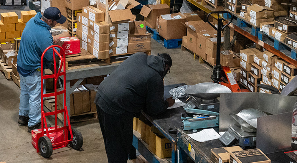 Warehouse workers checkout area Photo of workers checkout area loading up fasteners for customers